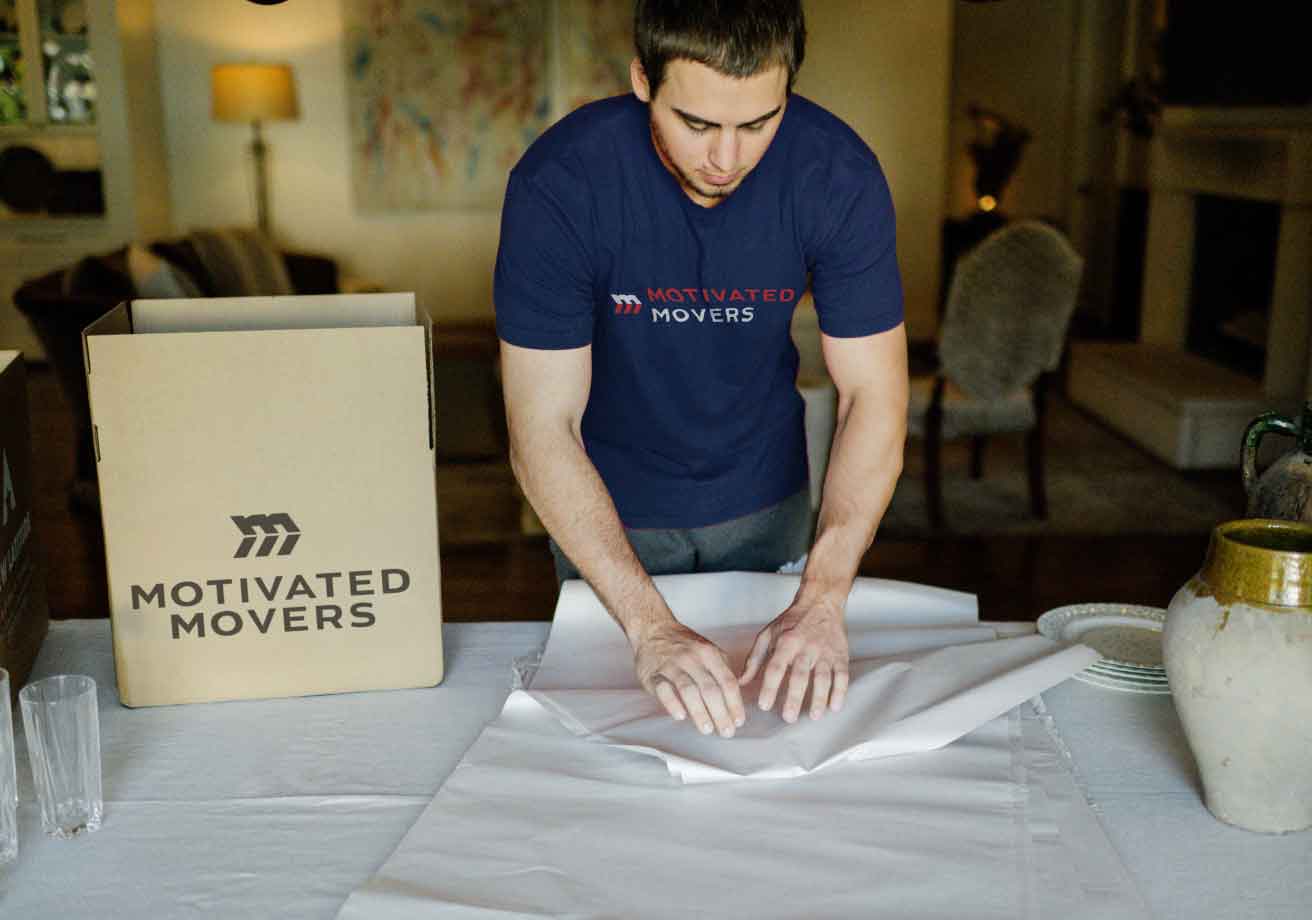 Motivated Movers packing carefully.